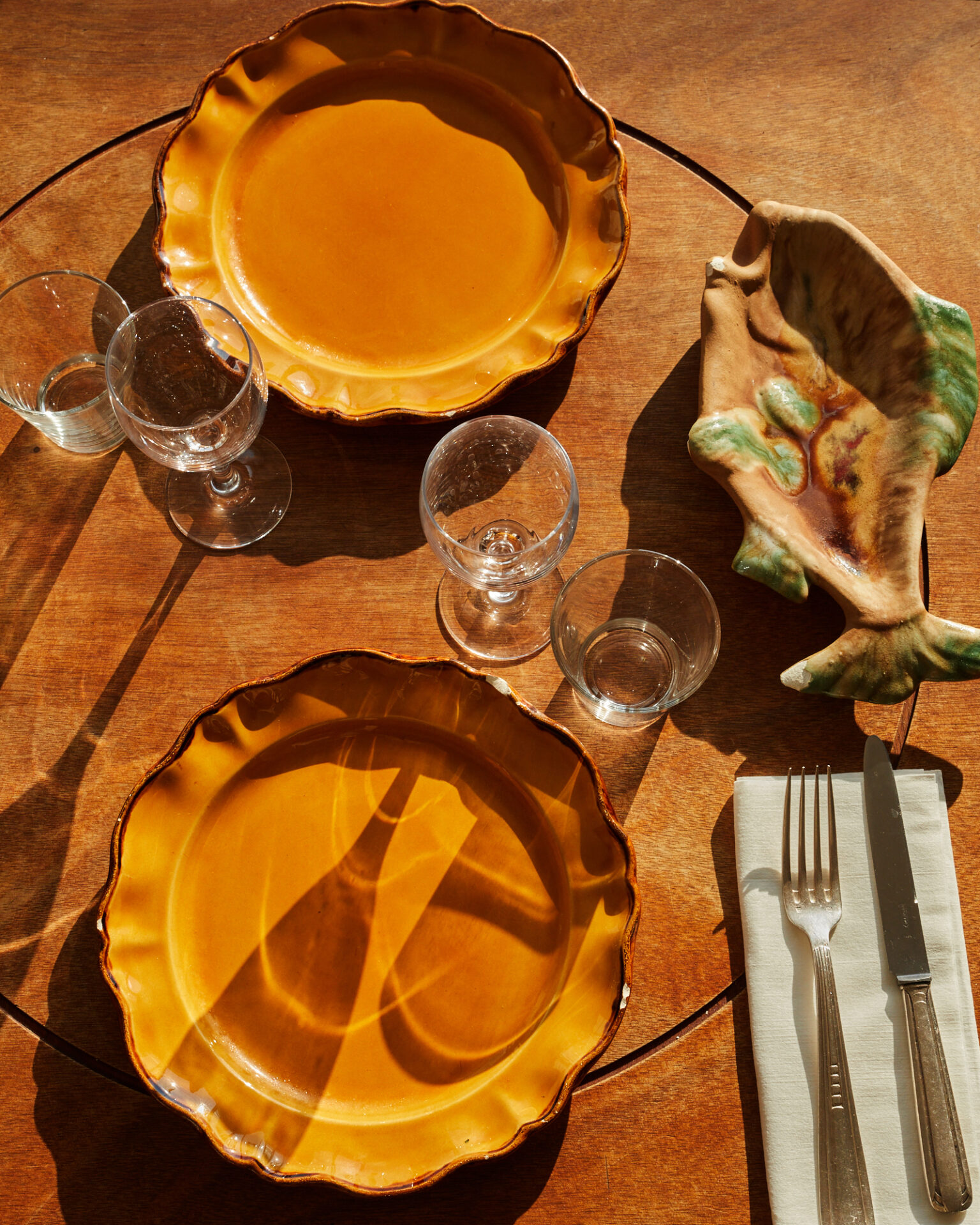 a table with plates and glasses