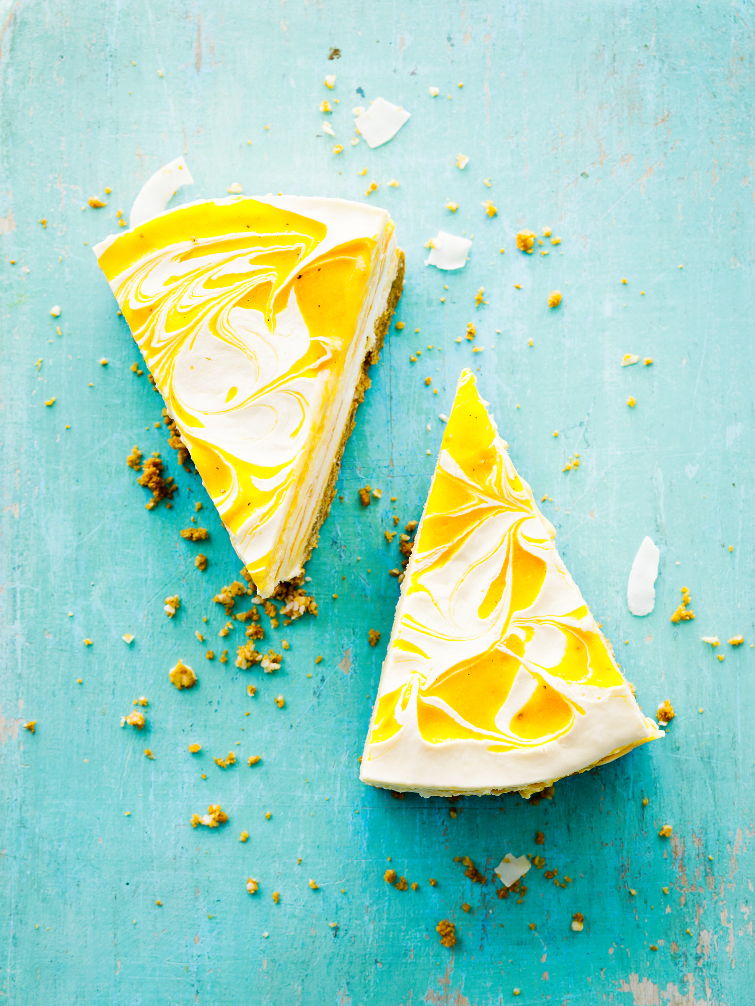 a slice of cheesecake on a blue surface