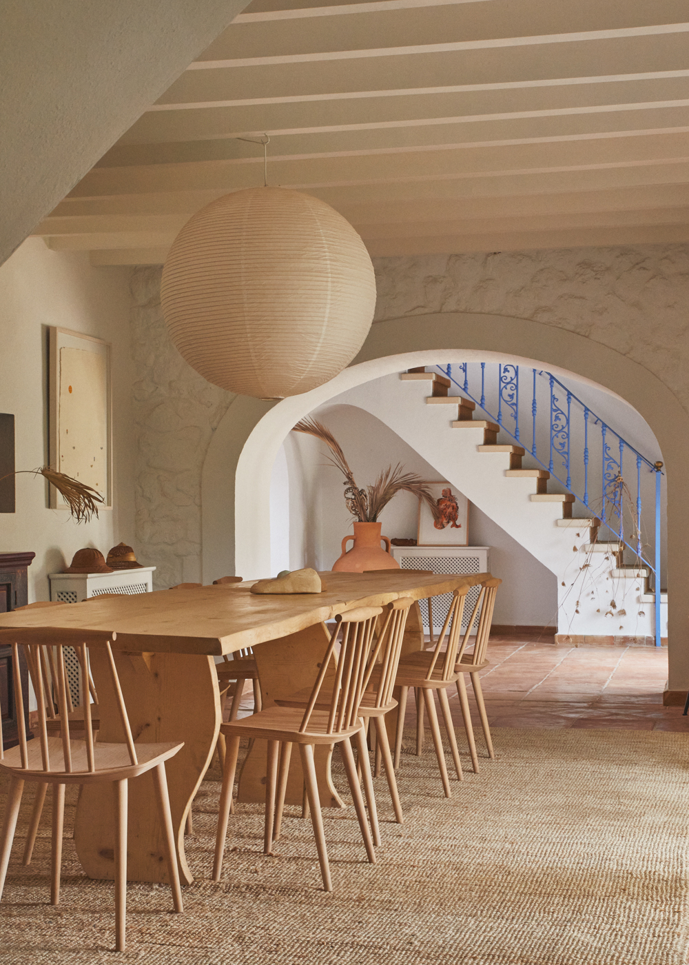 a dining table and chairs in a room