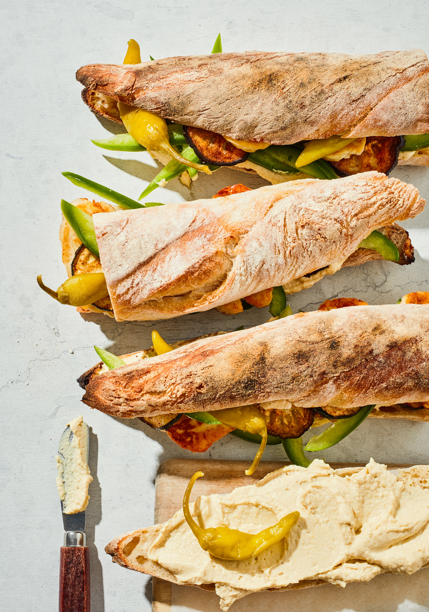 a group of sandwiches with different toppings