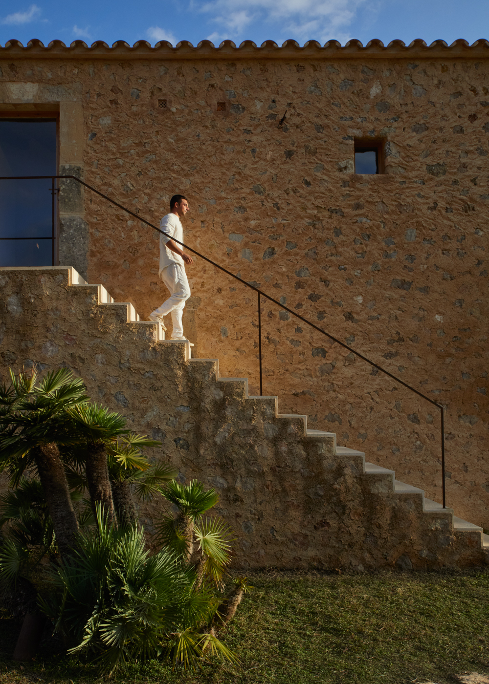 a man walking up a set of stairs