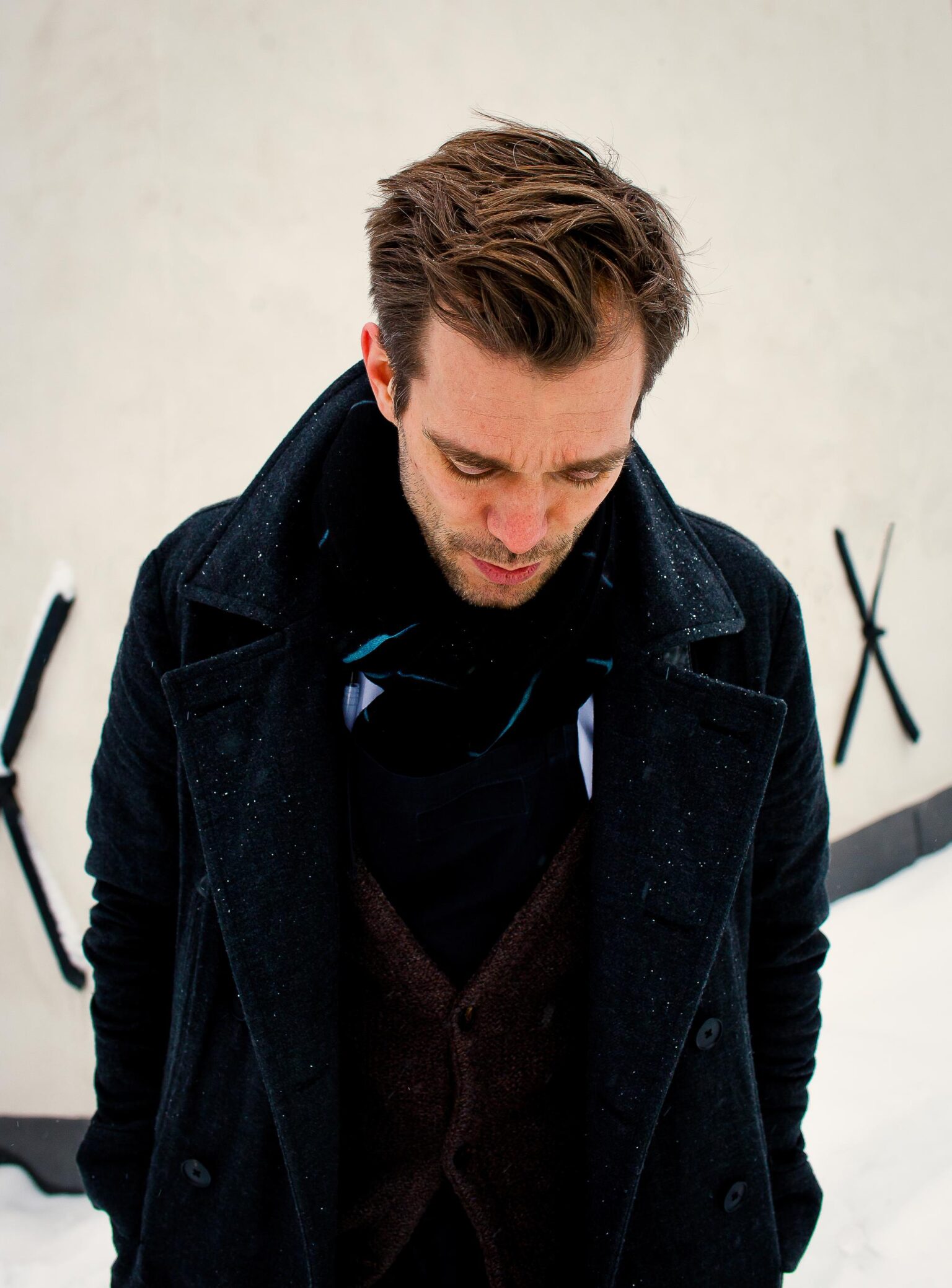 a man in a black coat