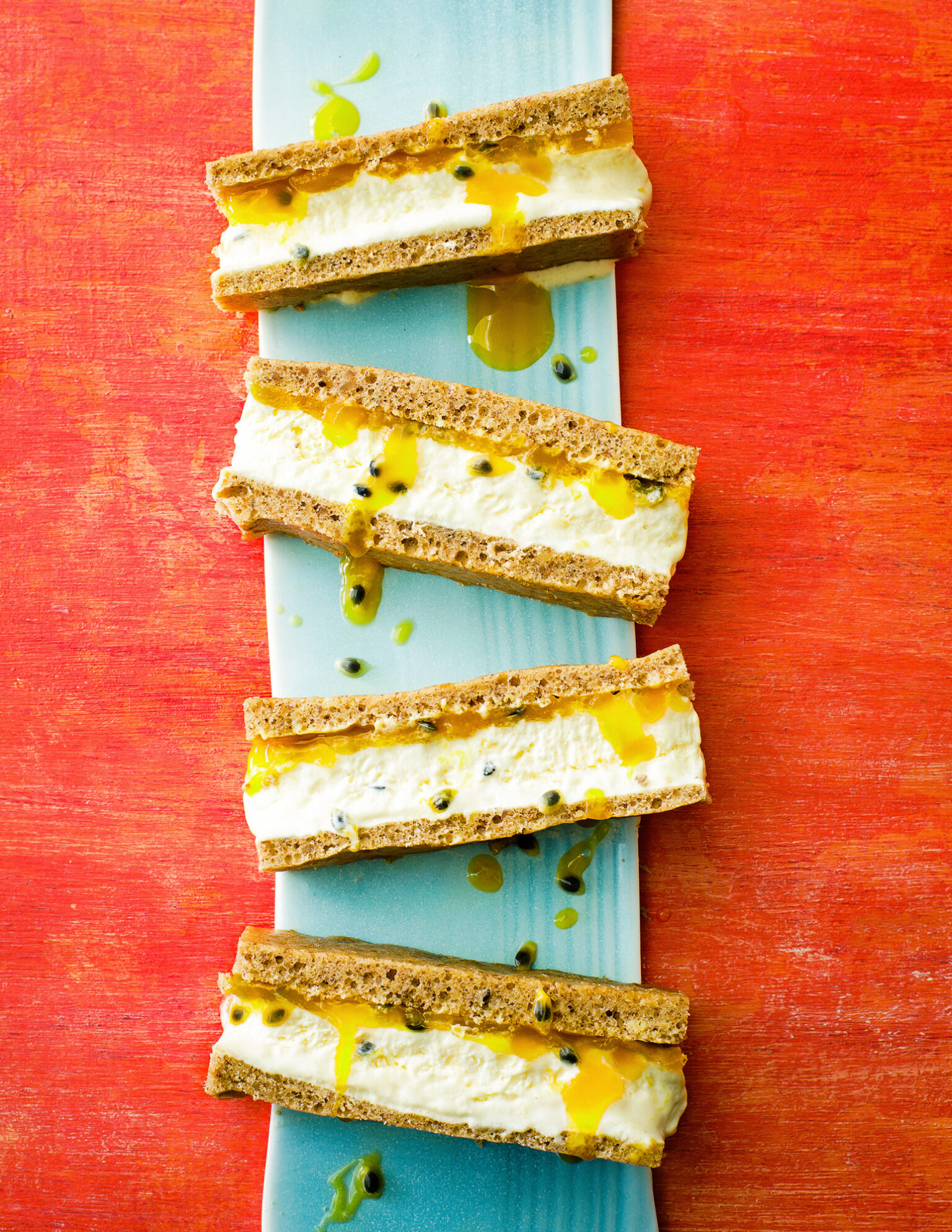 a plate of sandwiches with yellow sauce