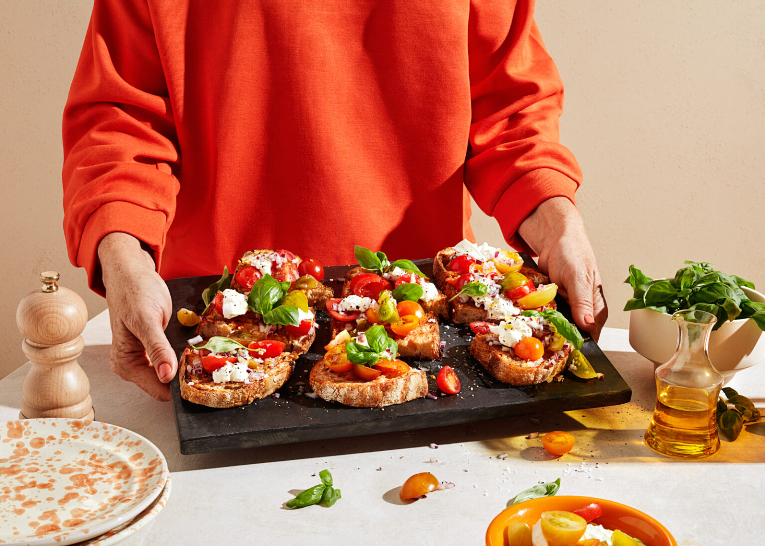 a person holding a tray of food