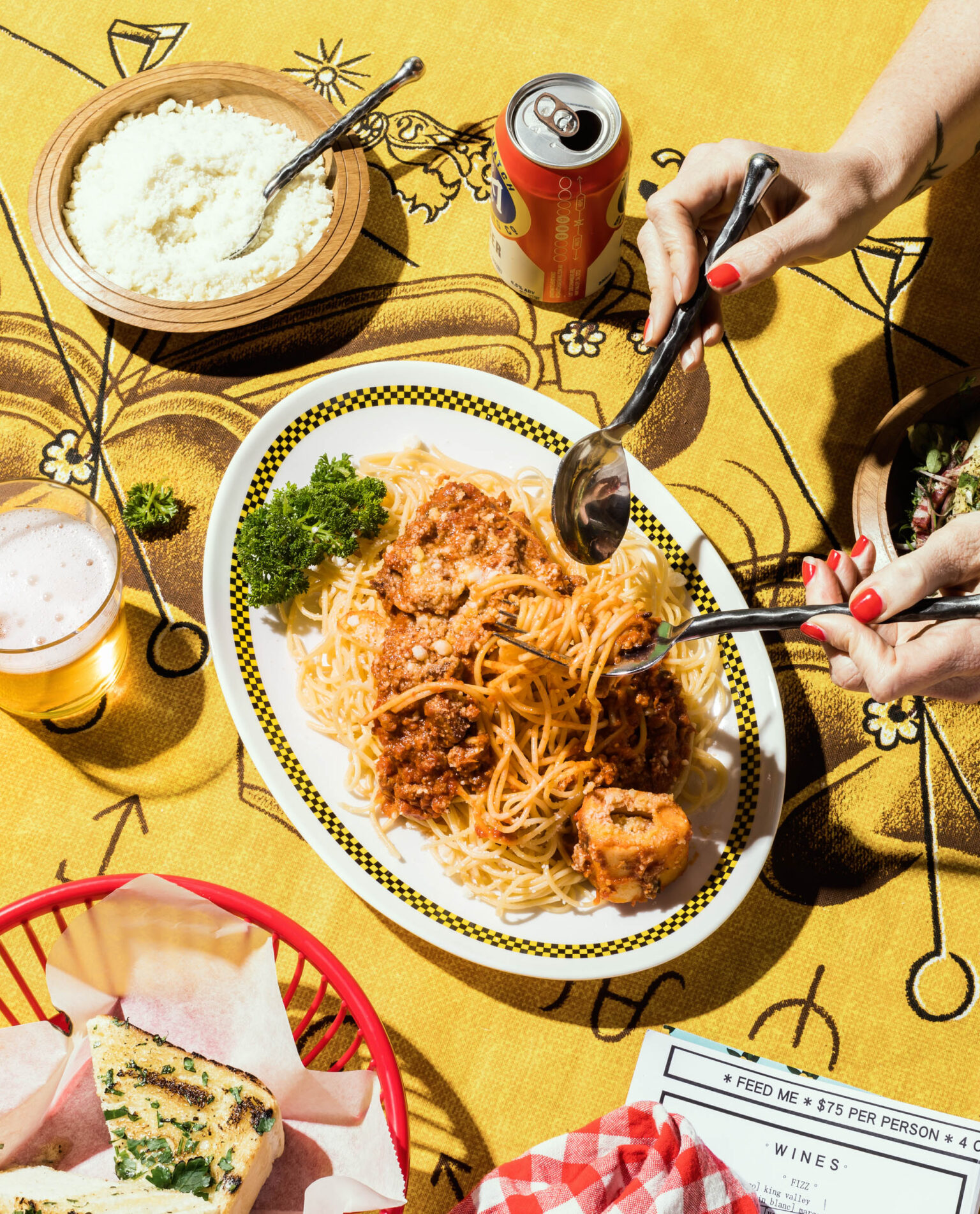 a plate of food with a couple of hands