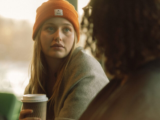 a woman in a beanie and a hat