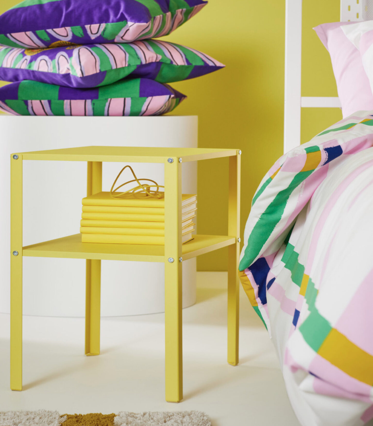 a yellow table with books on top of it
