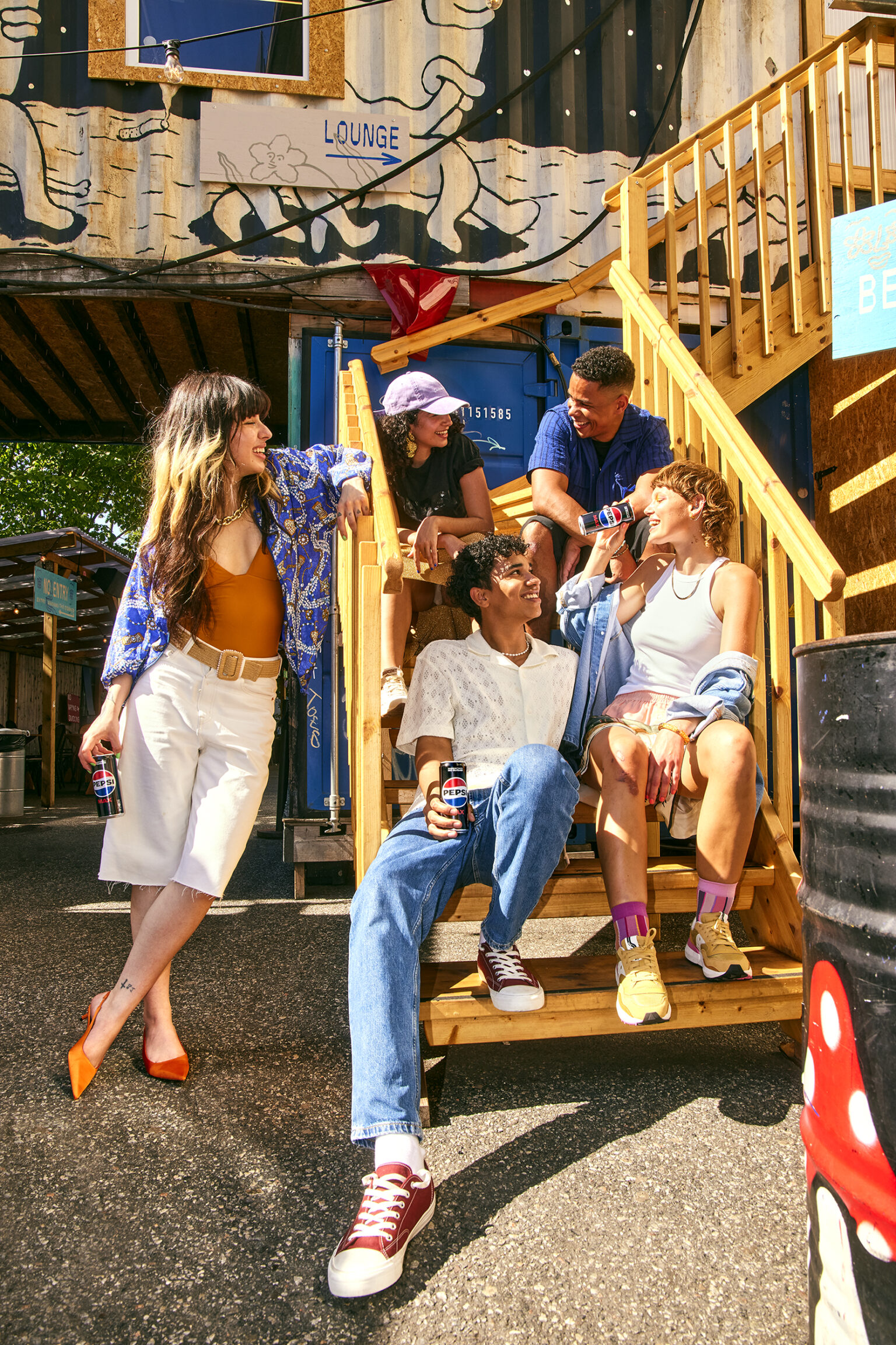a group of people sitting on stairs outside a building