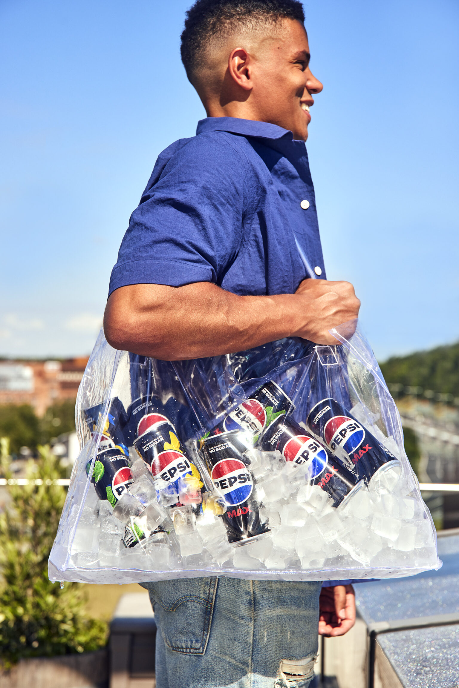a man carrying a bag of soda cans
