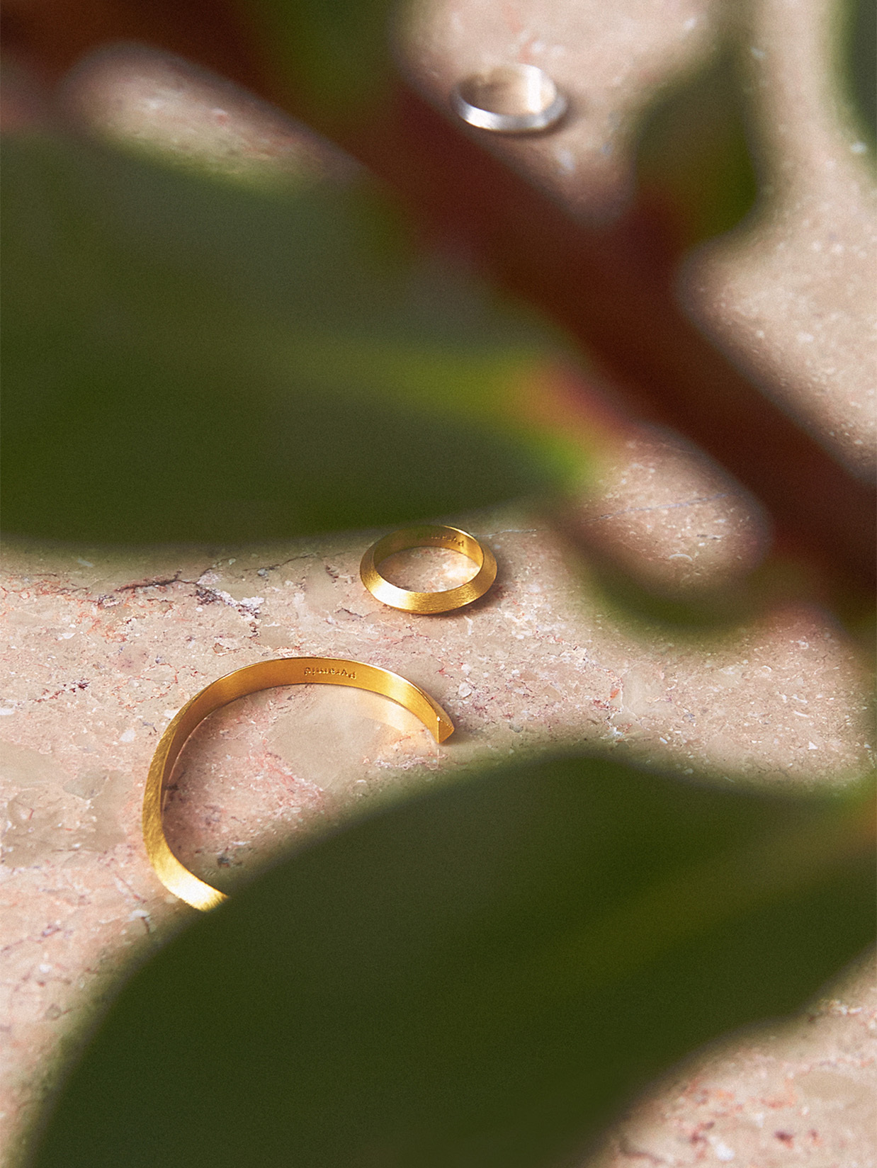 a gold ring on a marble surface