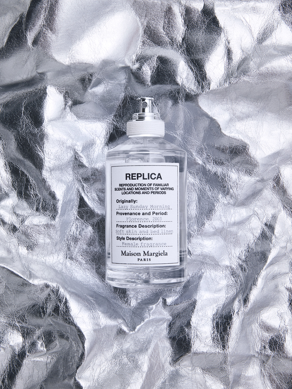 a bottle of perfume on a shiny surface