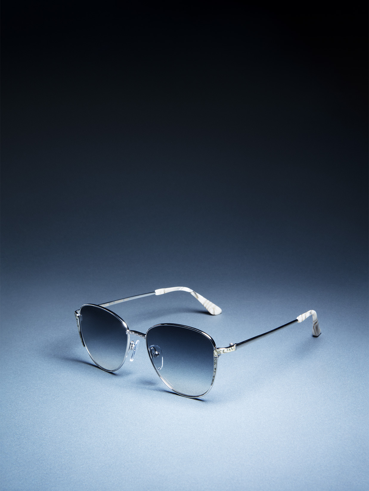 a pair of sunglasses on a blue background