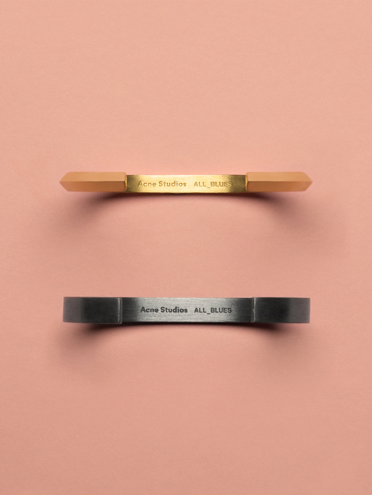 a pair of metal handles with text on them