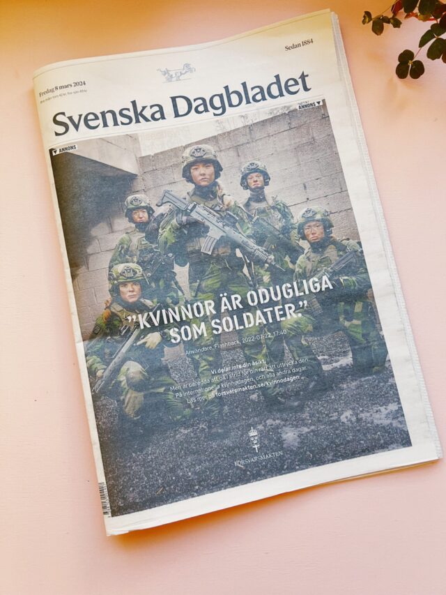 a newspaper with a group of soldiers
