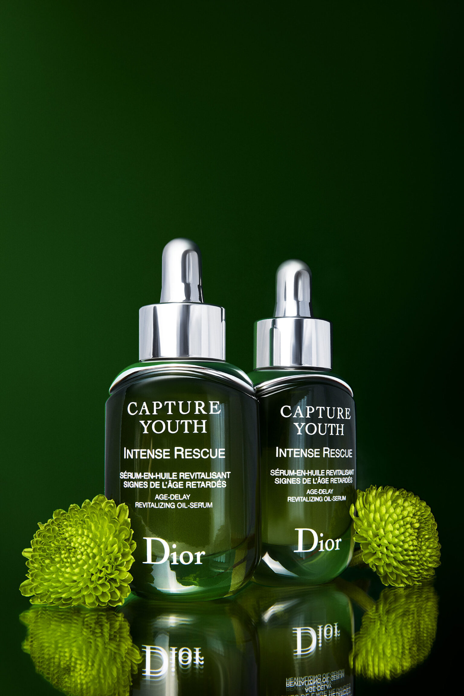 two bottles of cosmetics with green flowers