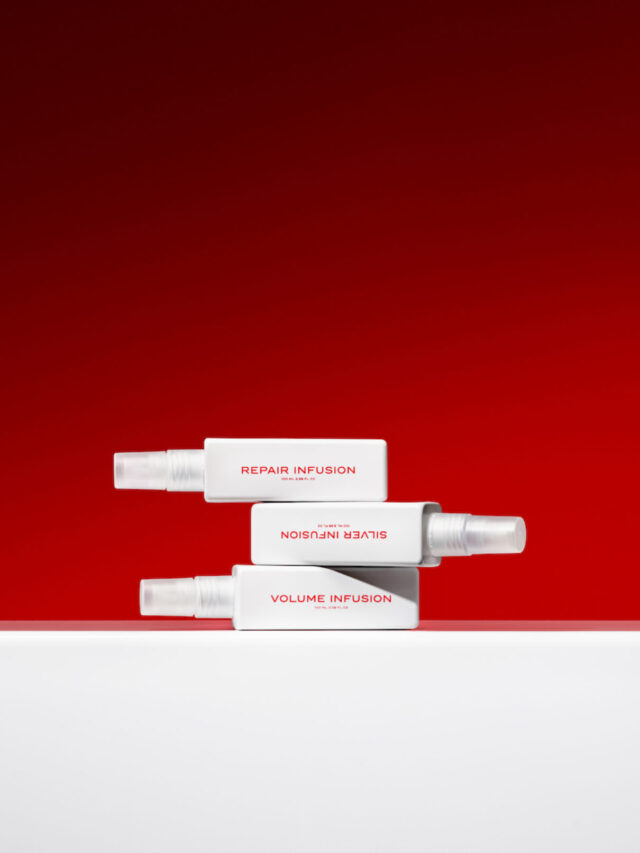 Three white spray bottles stacked, labeled Repair, Silver, and Volume Infusion.