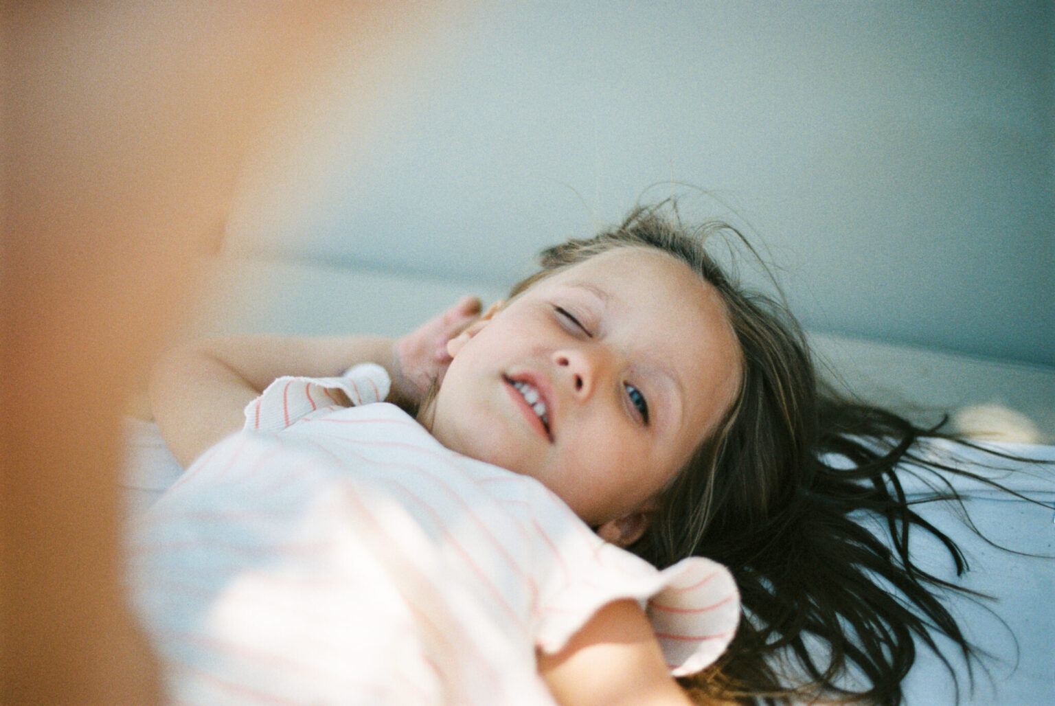 a girl lying on a bed