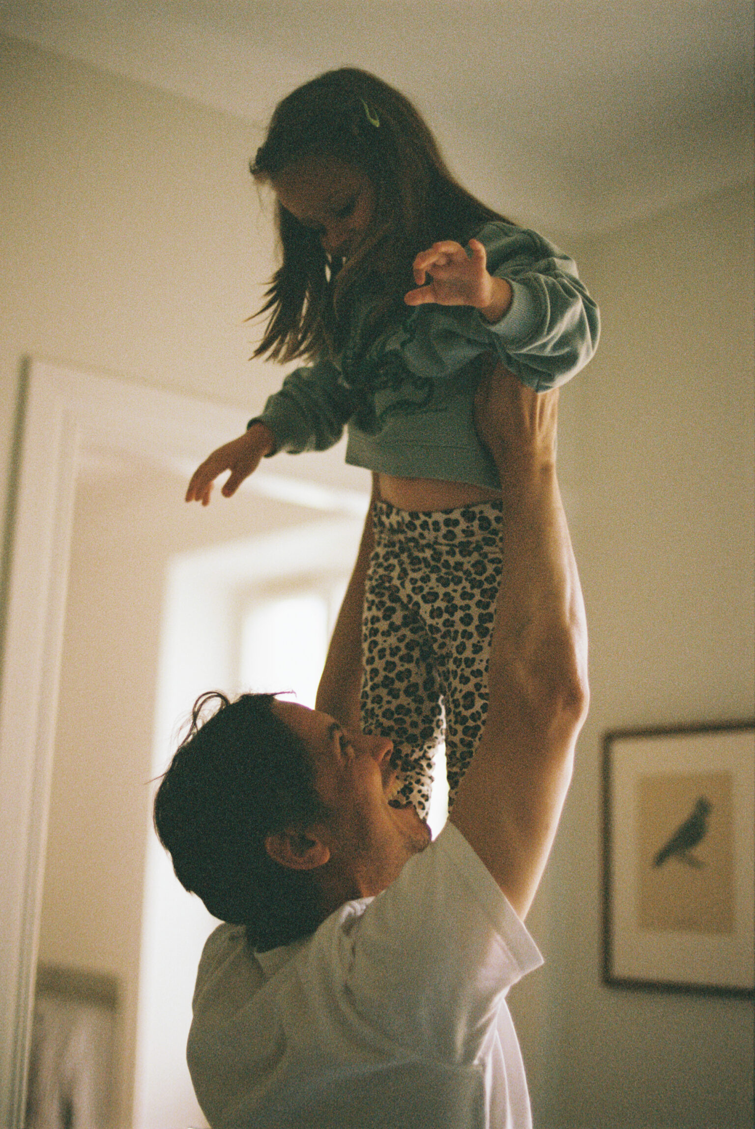 a man holding a child in his arms