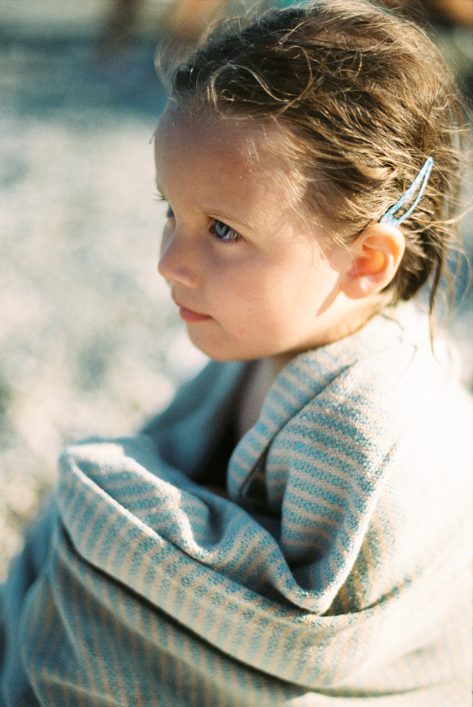 a child wrapped in a blanket