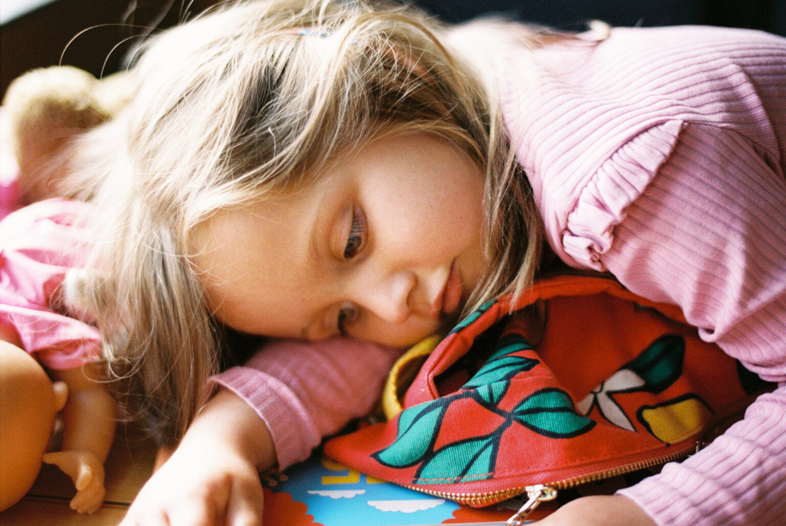 a girl lying on a book