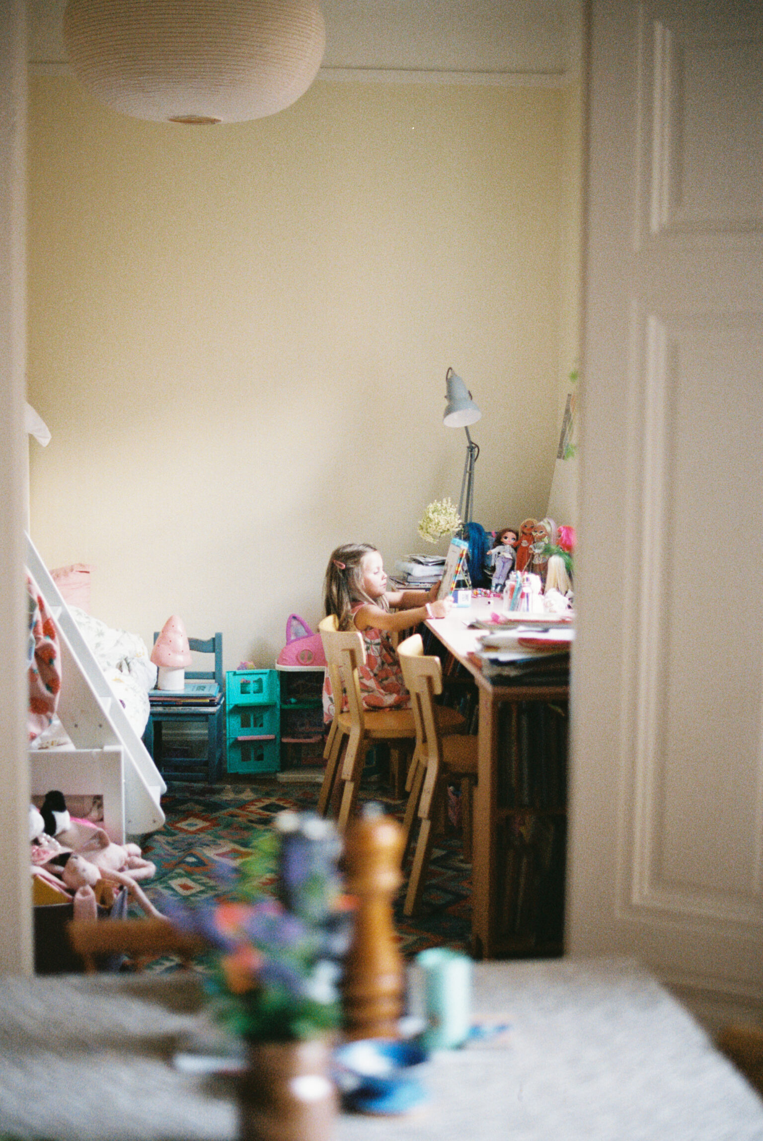 a girl sitting at a desk