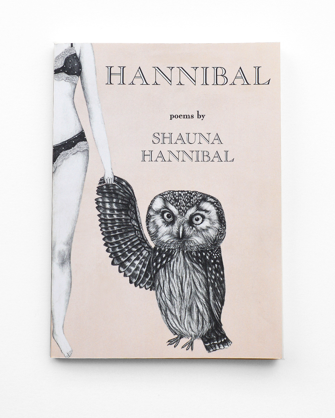 a book with a drawing of a woman and a owl