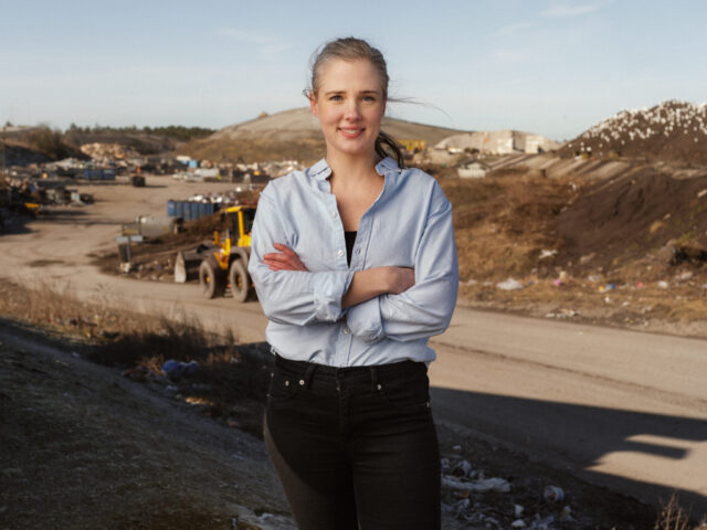 a woman standing with her arms crossed