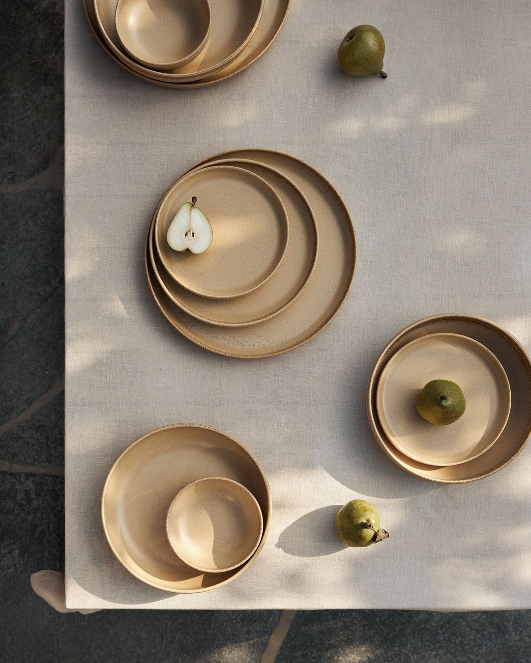 a table with plates and fruit