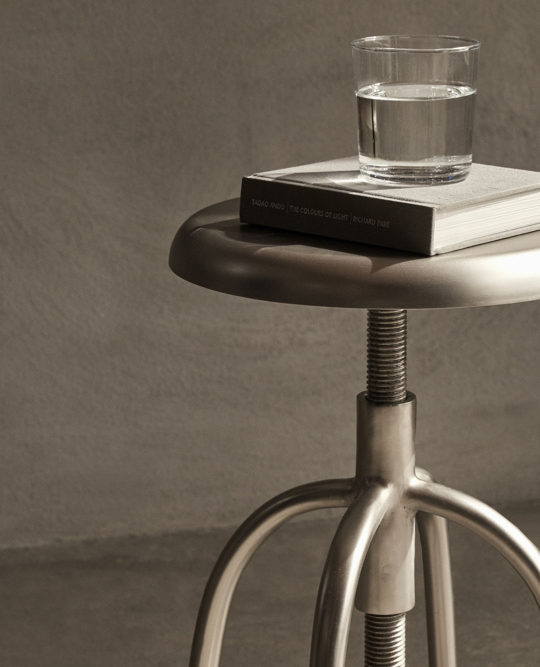 a glass of water on a book on a table