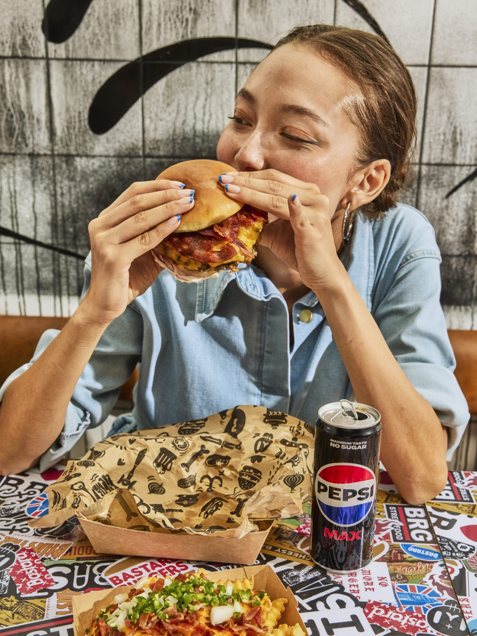 a woman eating a burger