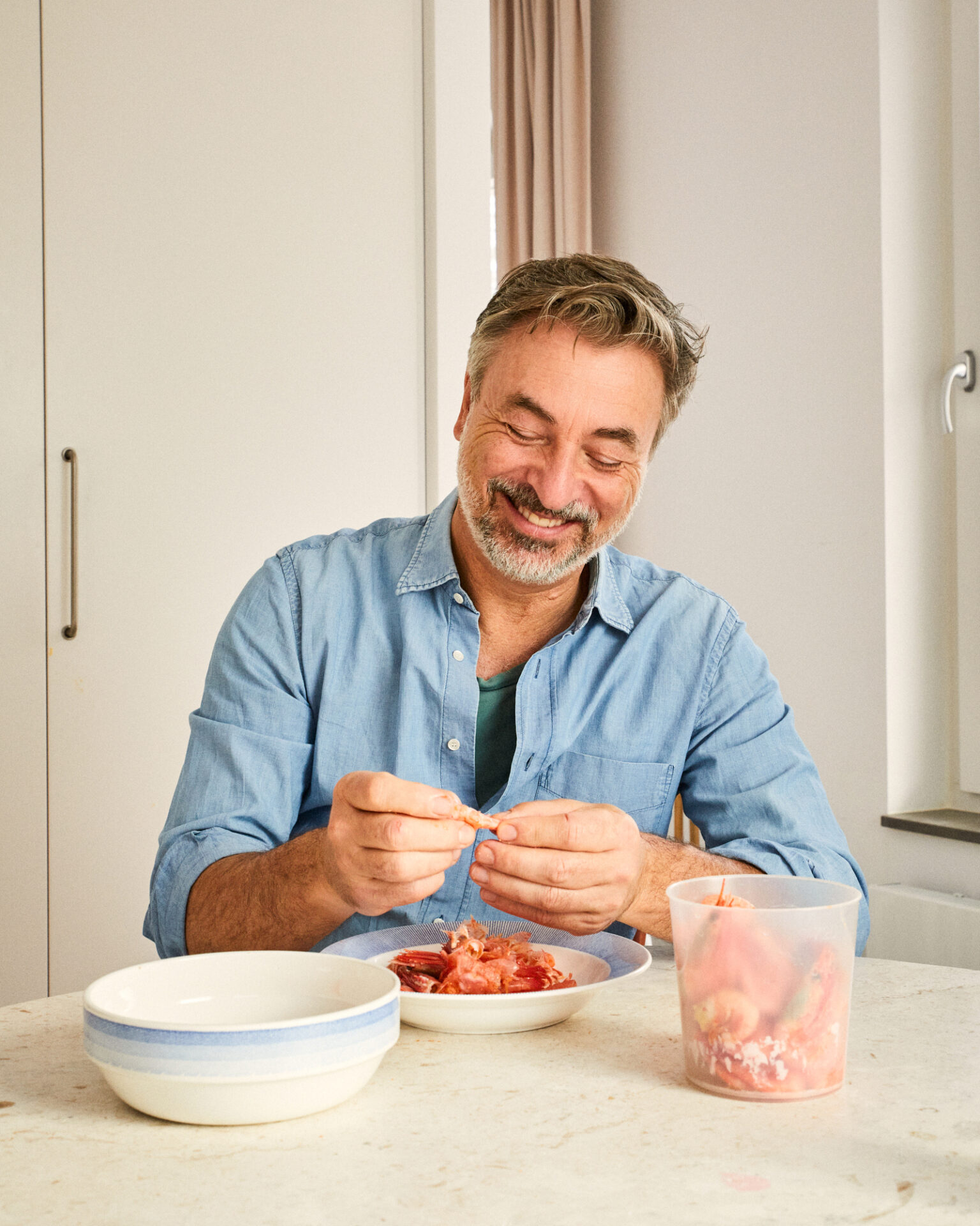 a man sitting at a table eating food