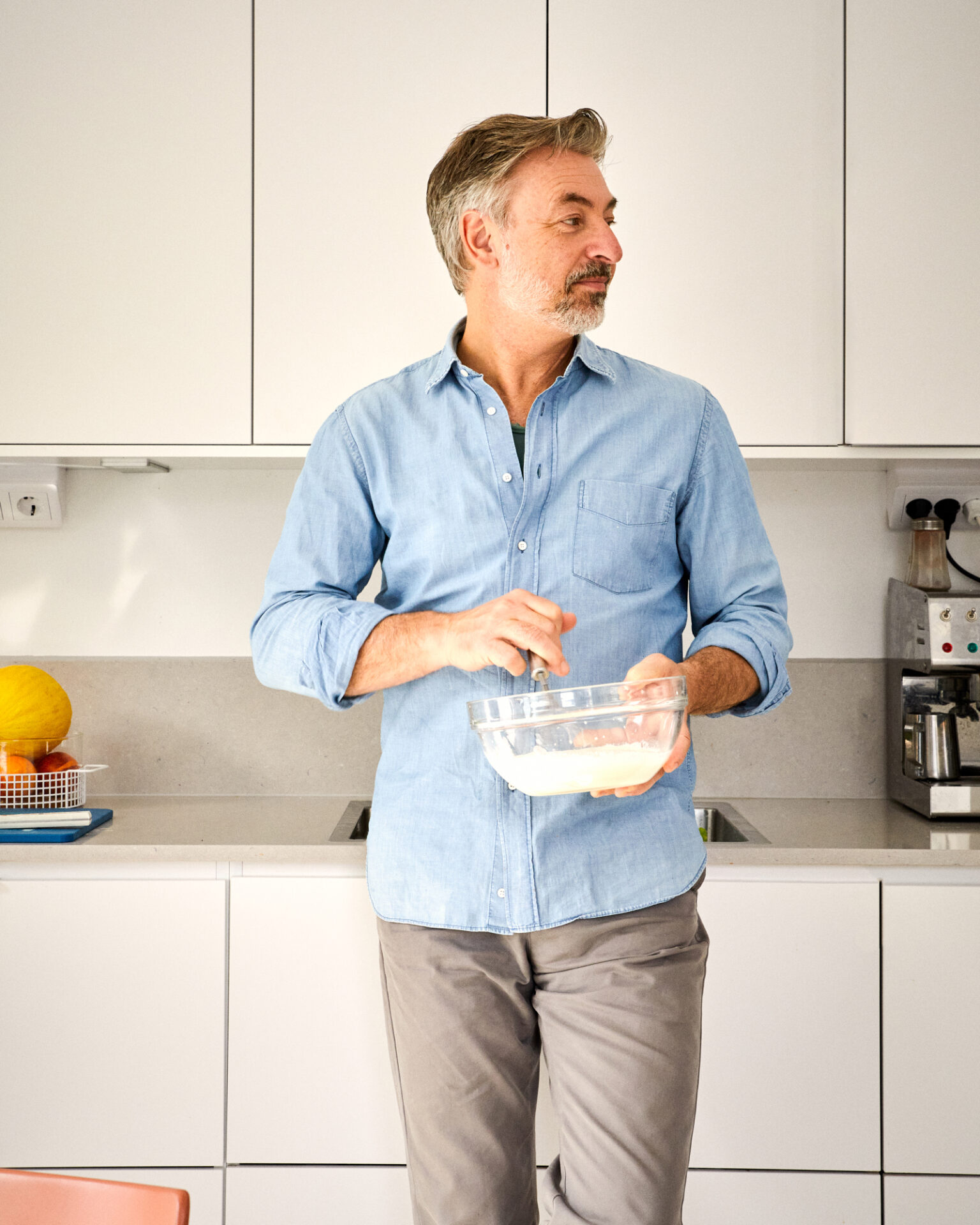 a man holding a bowl of food