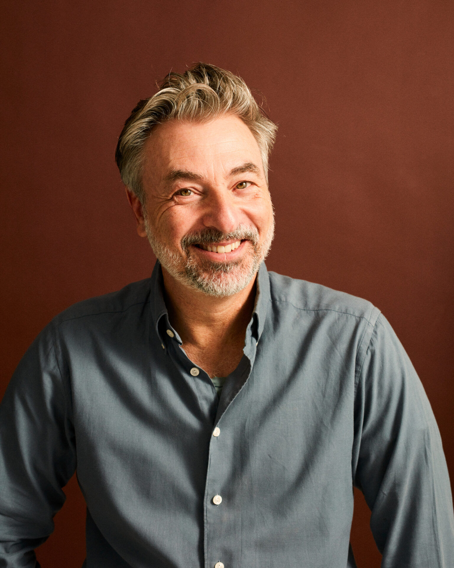 a man smiling at the camera