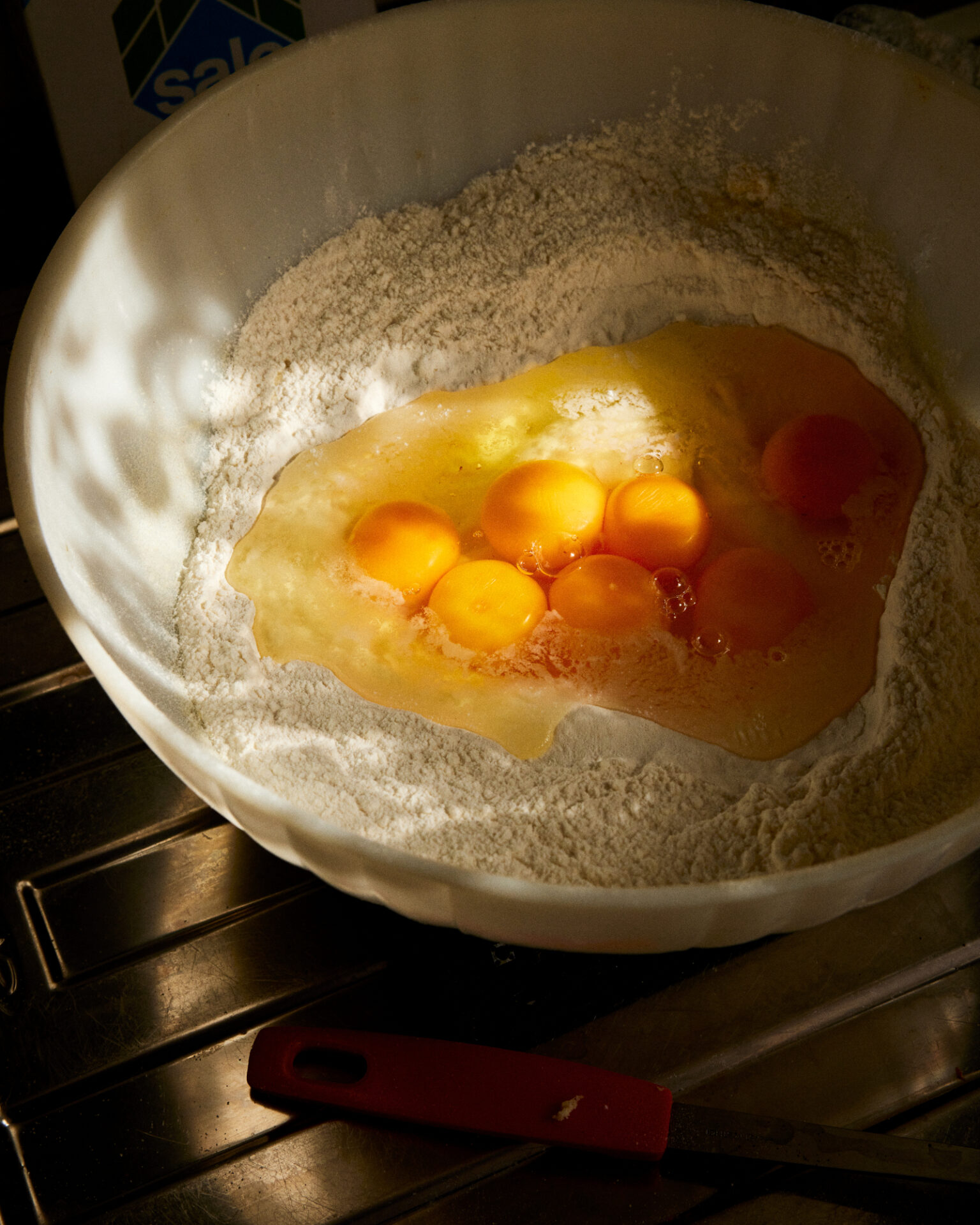 eggs in a bowl with flour and eggs