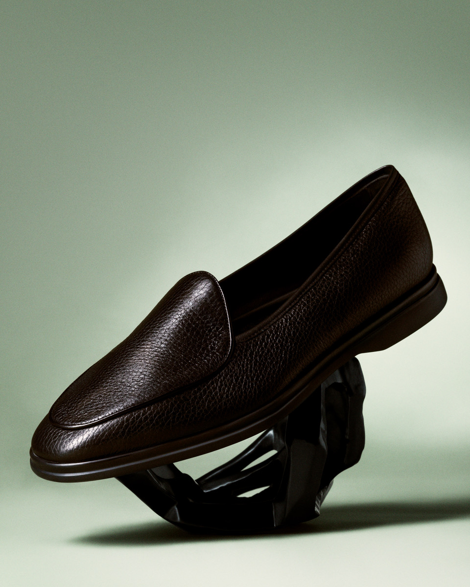 a black loafer on a ball