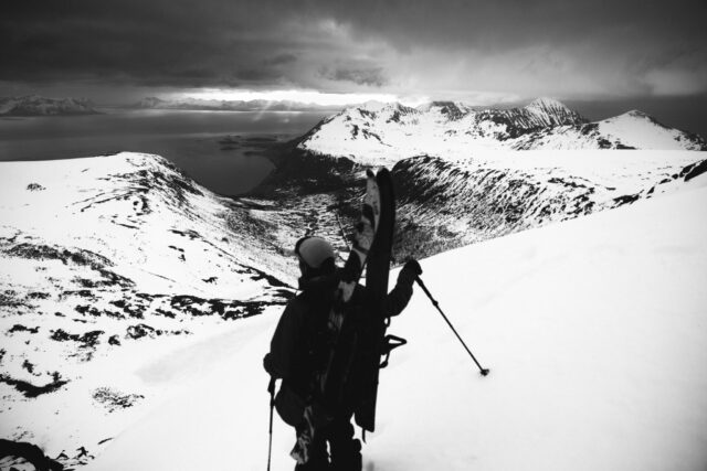 a person with skis on a snowy mountain