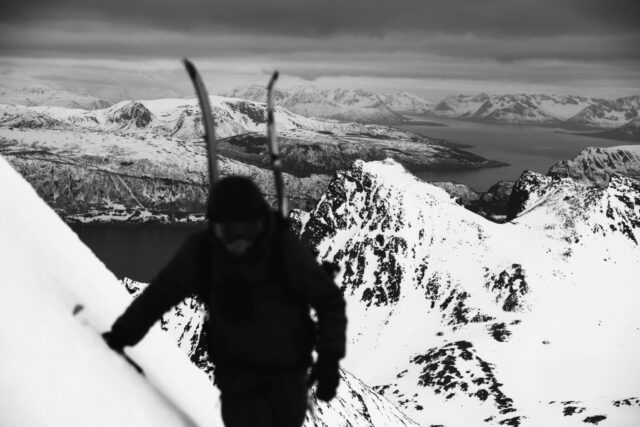 a person walking on a snowy mountain