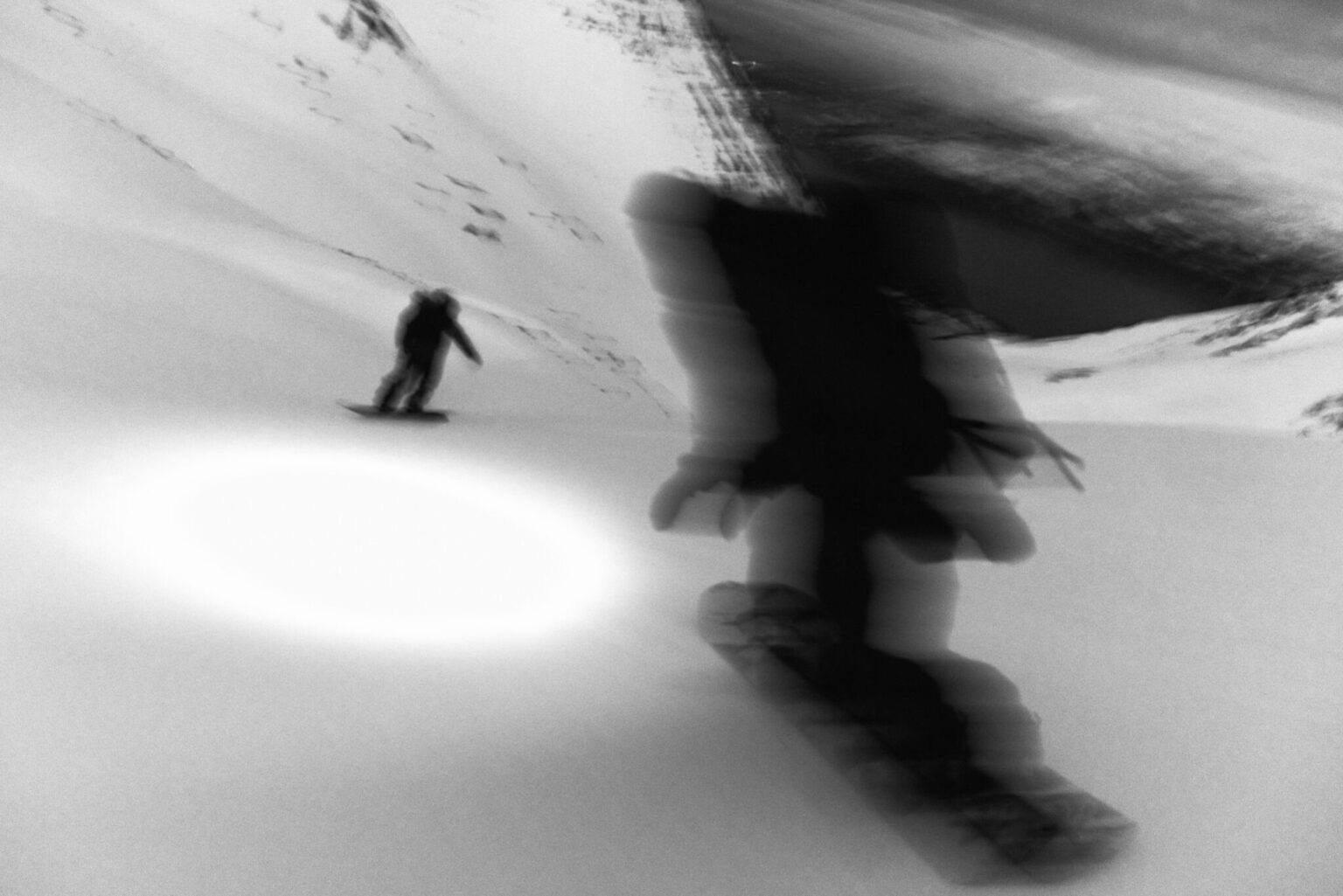 a blurry image of a person skiing down a snowy hill
