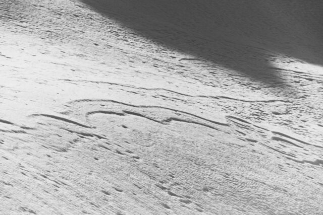 a white surface with a shadow