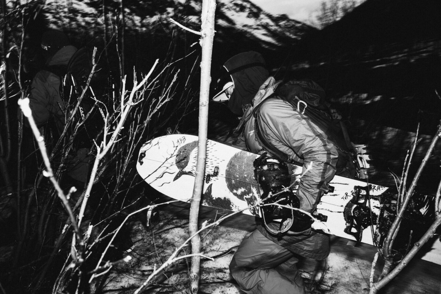 a person carrying a snowboard