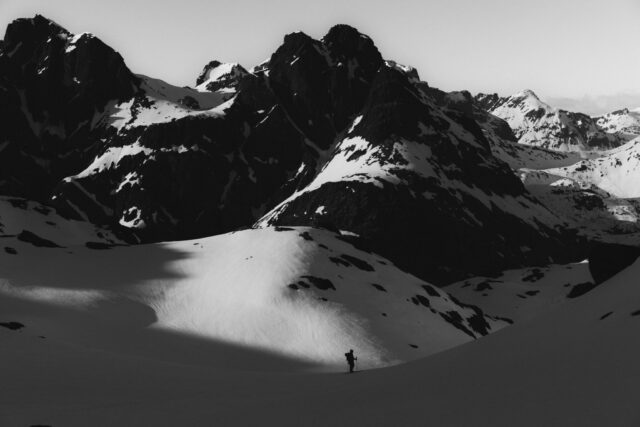 a person walking on a snowy mountain