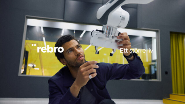 a man holding a machine