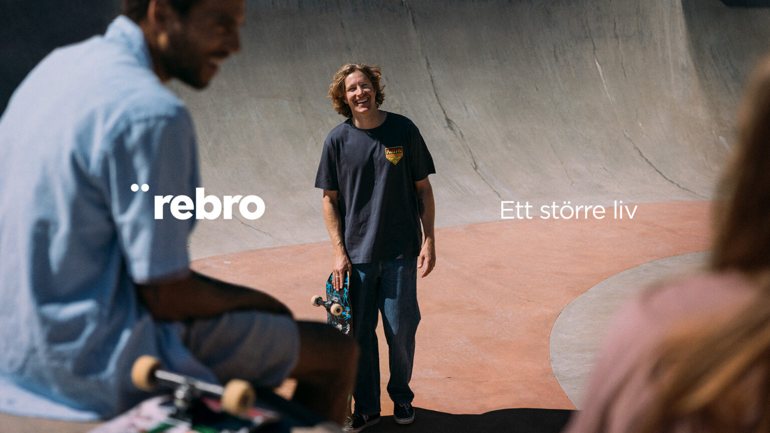 a man holding a skateboard