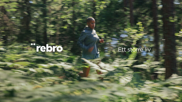 a woman running through the woods
