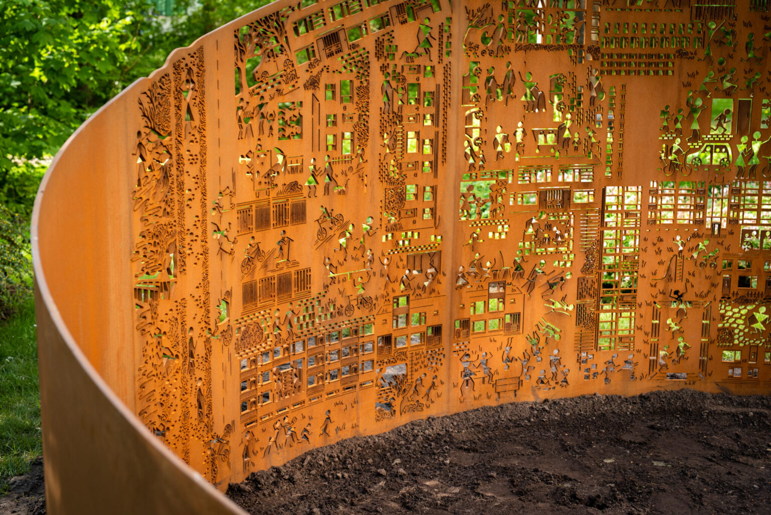 a metal sculpture with many images