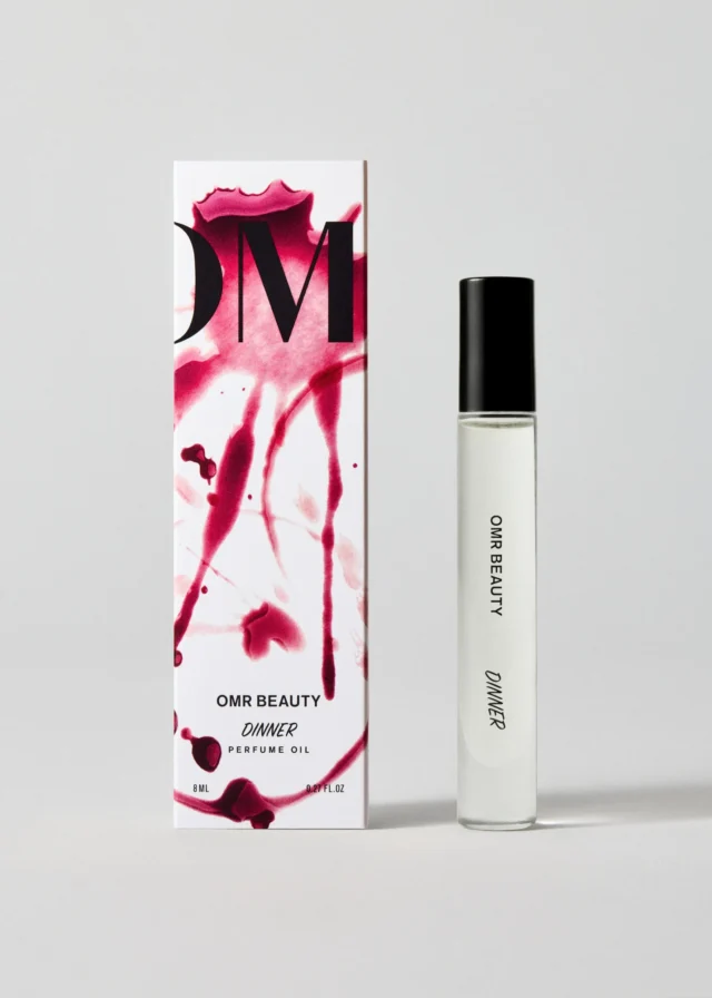 a bottle of perfume next to a box