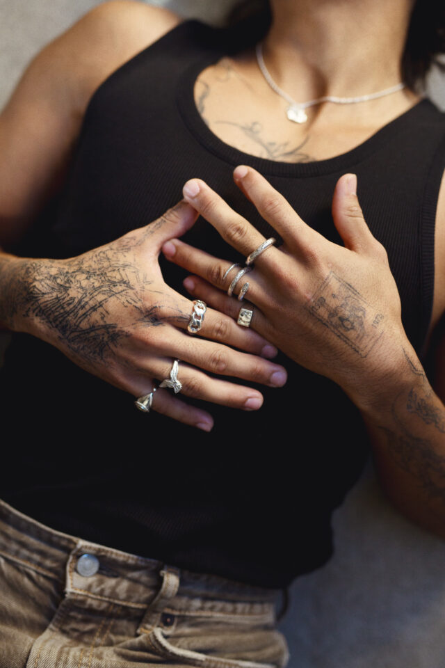 a person with tattoos on their hands