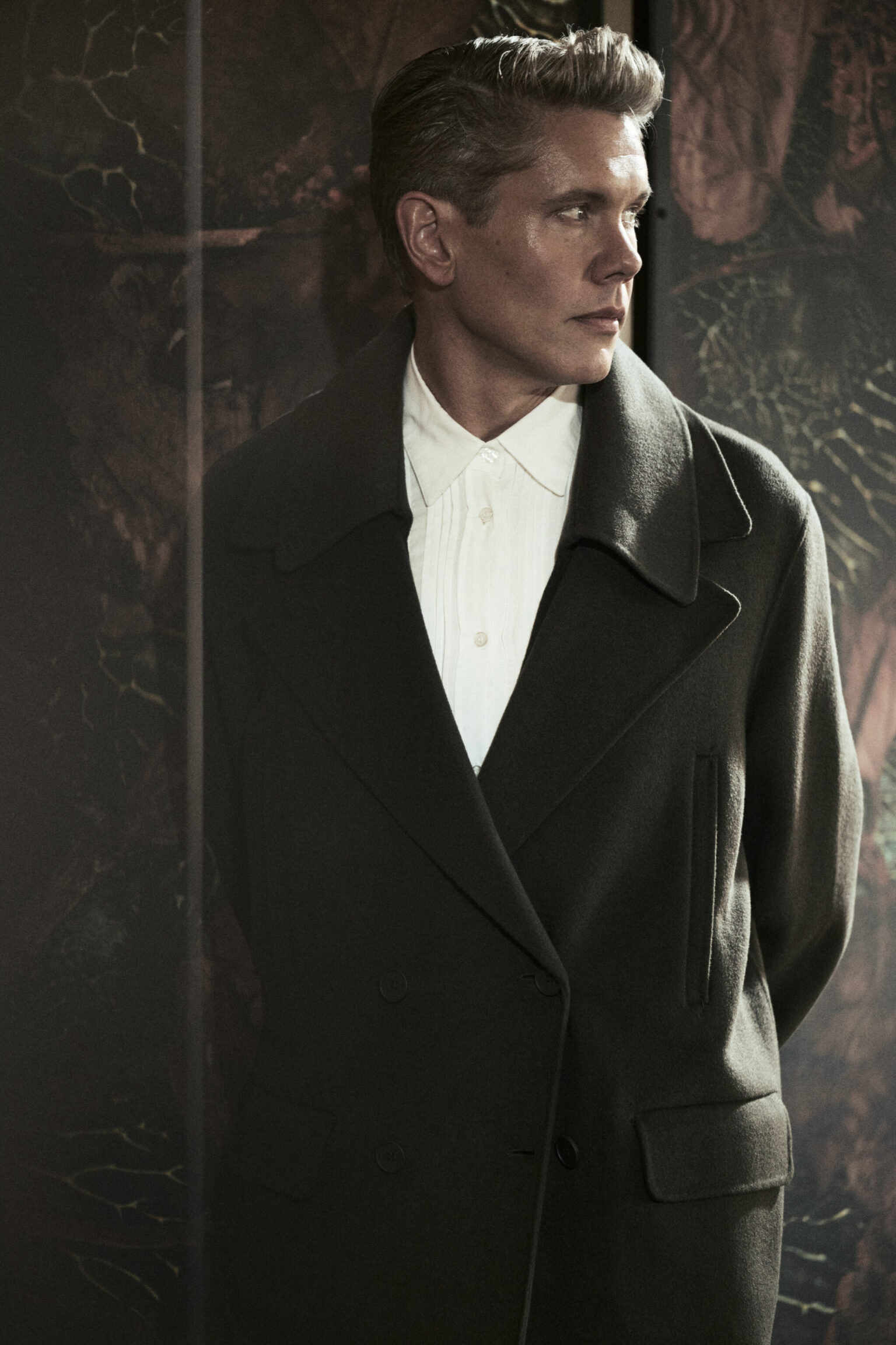 a man in a black coat