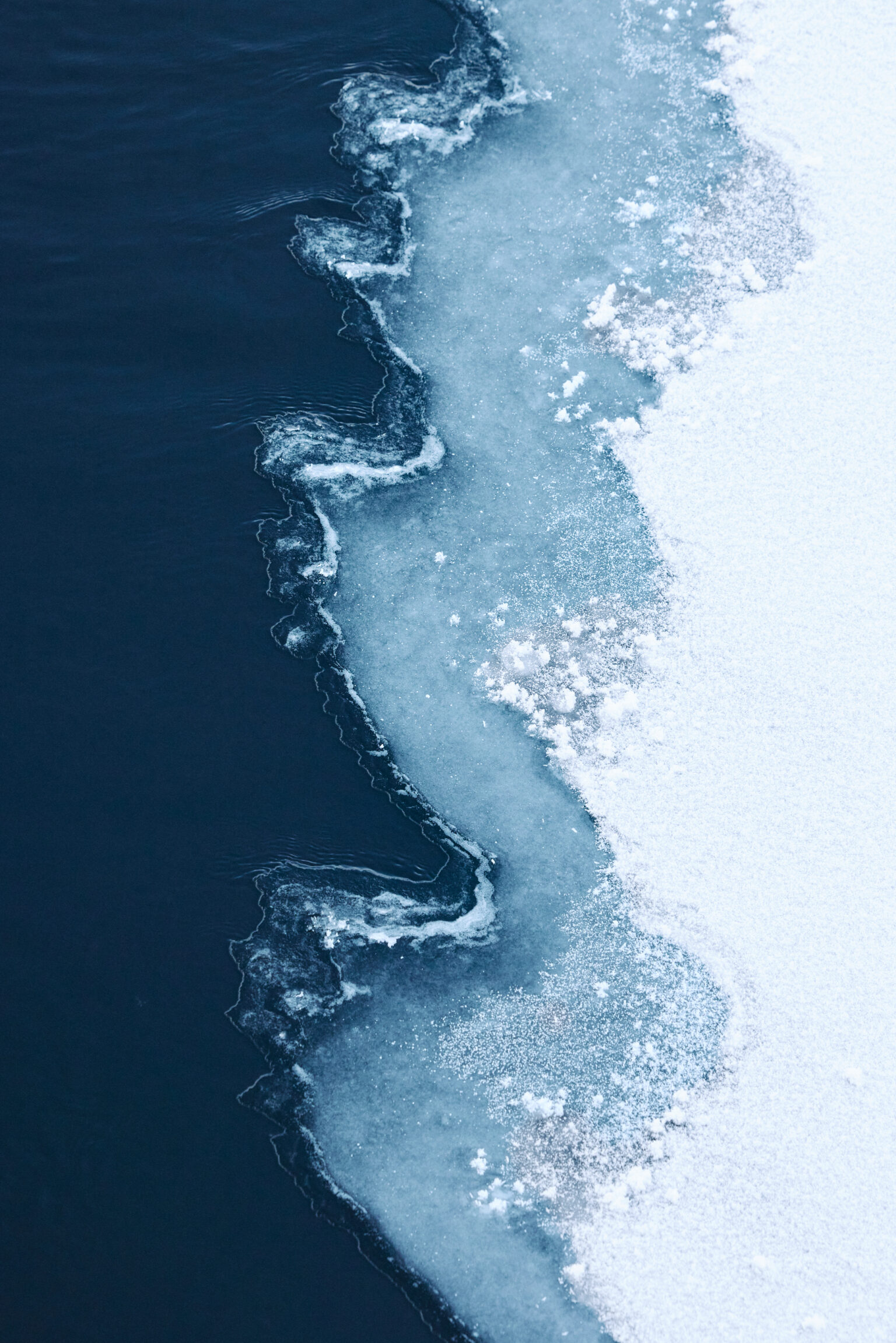 a frozen water with ice and snow