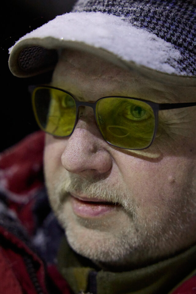 a man wearing a hat and glasses